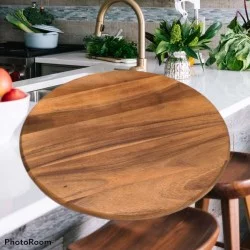 Kitchenware: Teakwood Round Cutting Board made of teakwood (image 1 of 1).