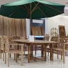 Outdoor dining table oval for terrace or garden made of teak wood.