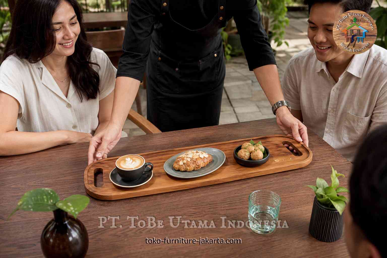Long wood cafe tray with handles carrying coffee and pastries at a table