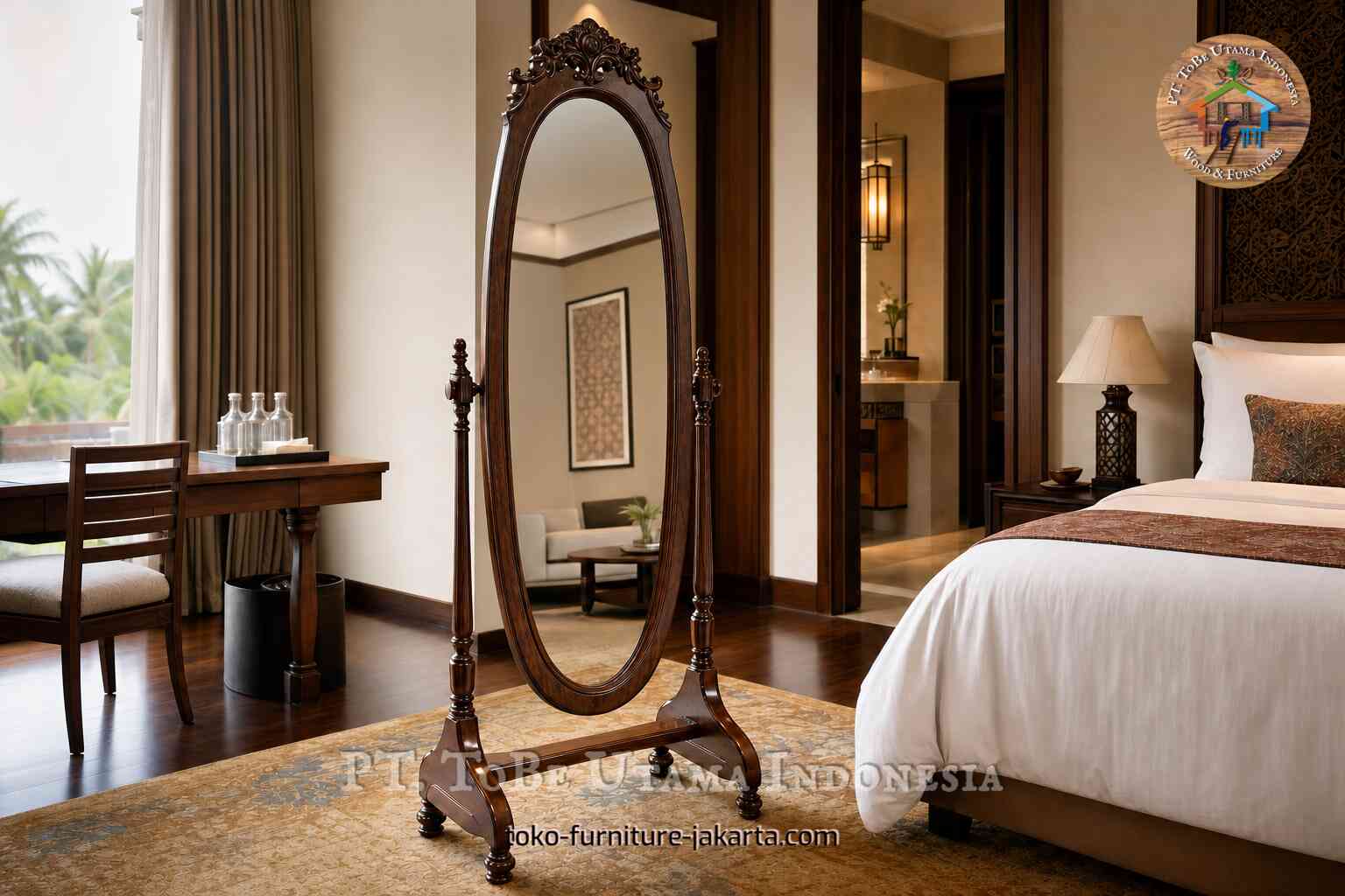 Decorative wooden standing mirror in a hotel room beside a bed and desk