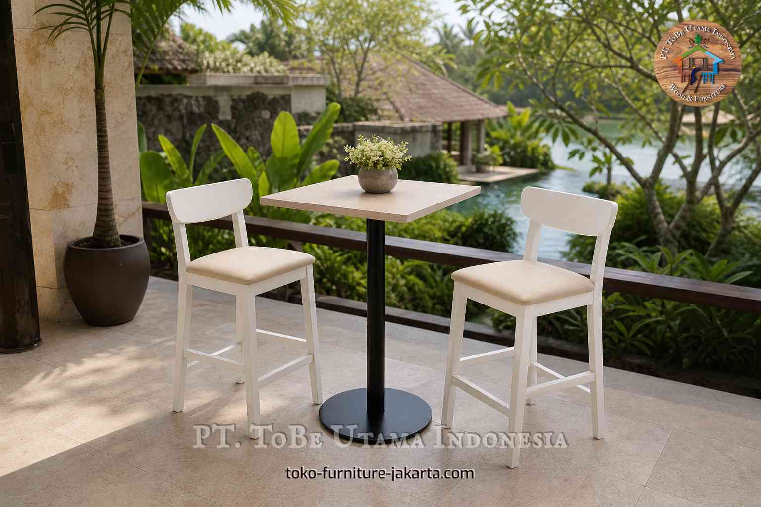 Two cream cafe chairs with padded seats beside a small table on a tropical garden terrace