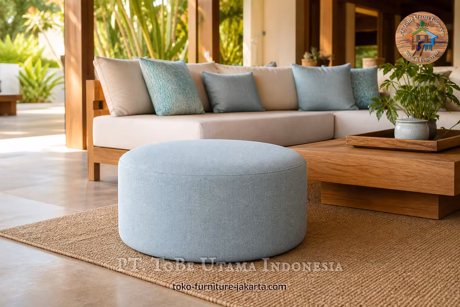 Light blue round upholstered seat in a warm living room with sofa and wooden table