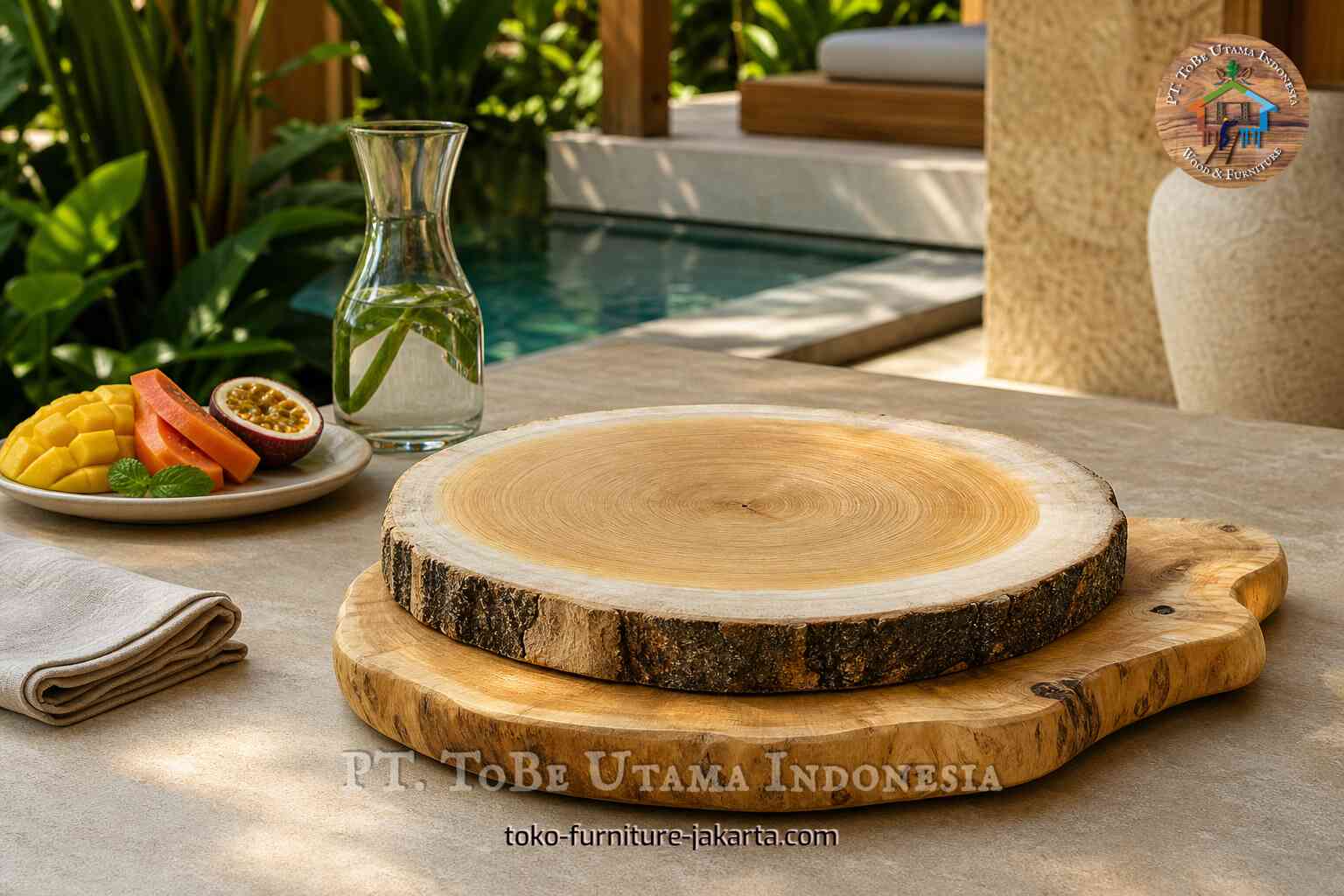 Live-edge wooden cutting board on a stone table with tropical fruit and poolside decor