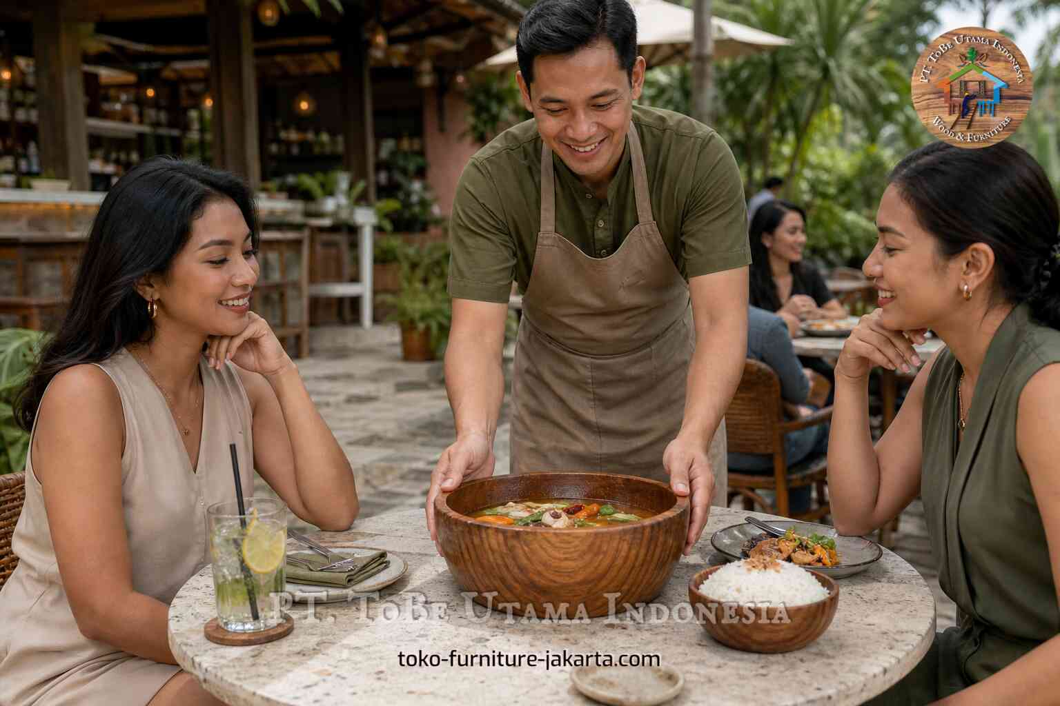 Large wooden bowl served at an outdoor cafe table with smiling guests and a server