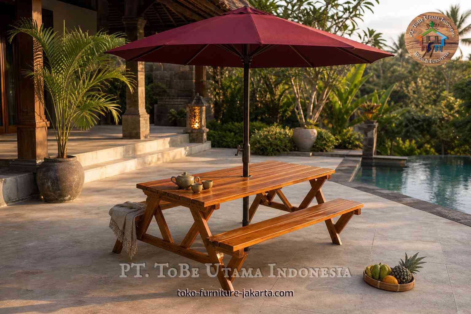 Wood-toned outdoor bench and table set with a red patio umbrella in a poolside garden setting